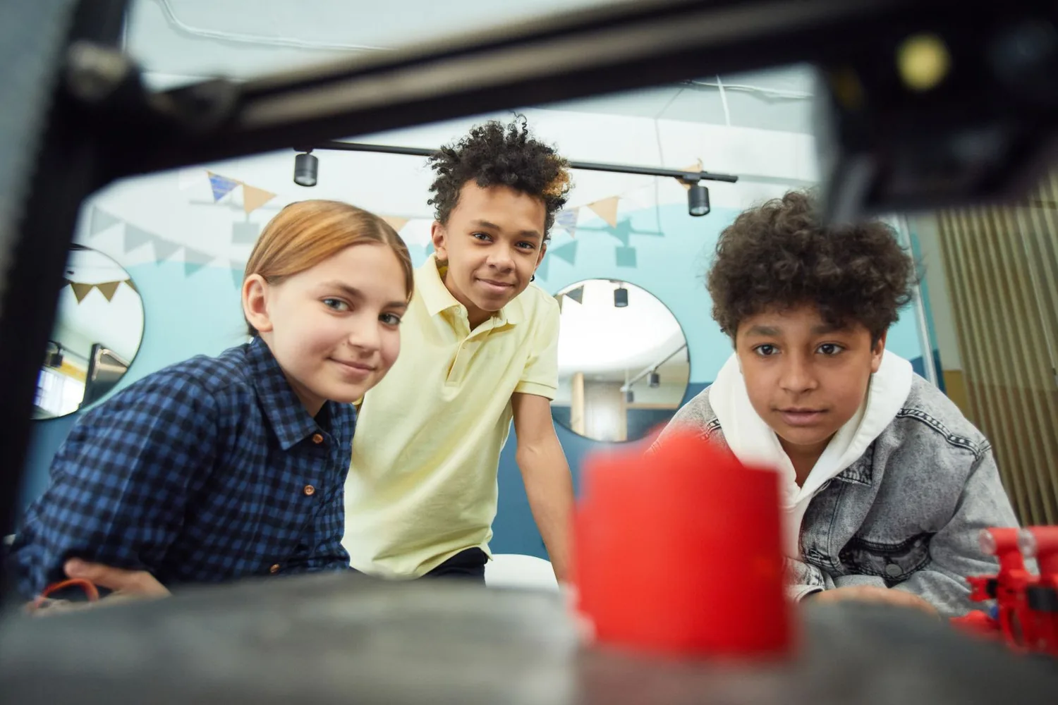 Illustrative photograph of students viewing a 3D-printed project